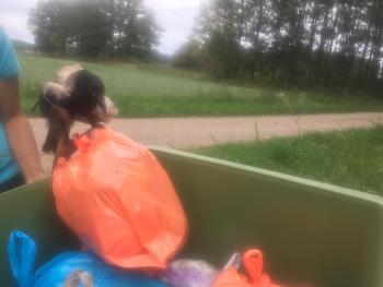 Jonas helping with the garbage